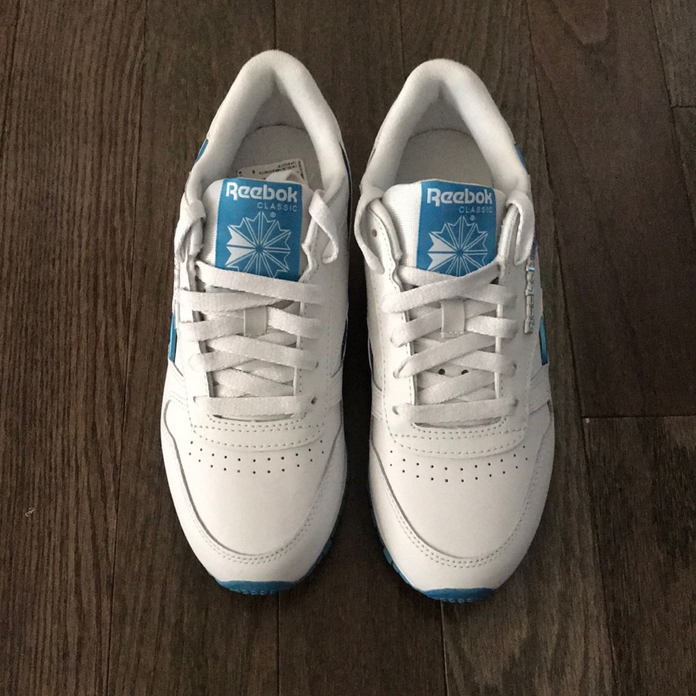 White and blue Reebok sneakers